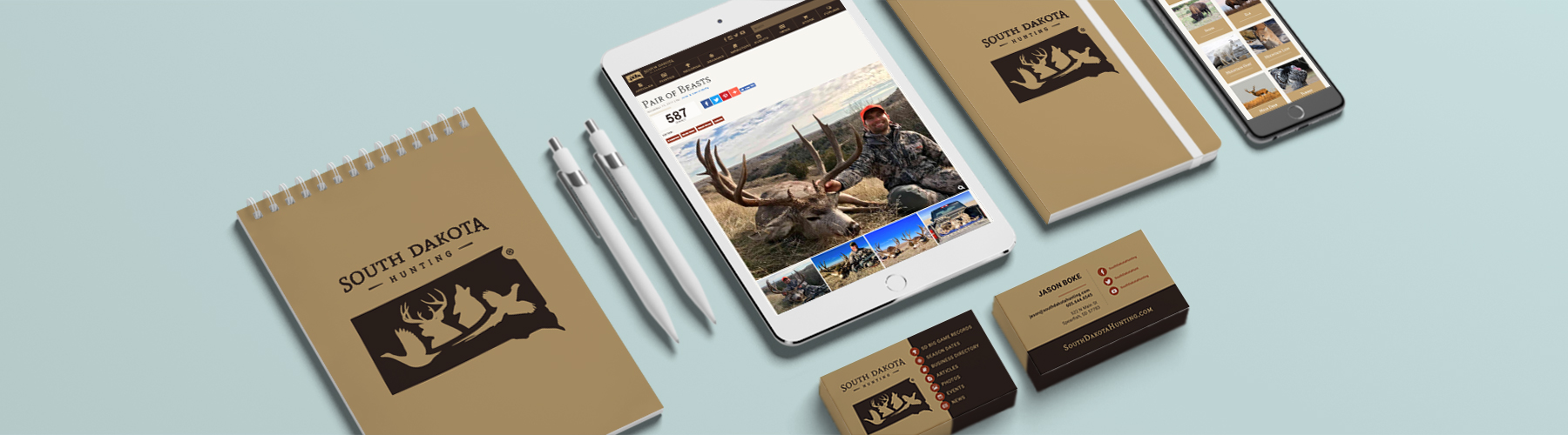 Marketing example with business cards, books, and website on ipad and iphone