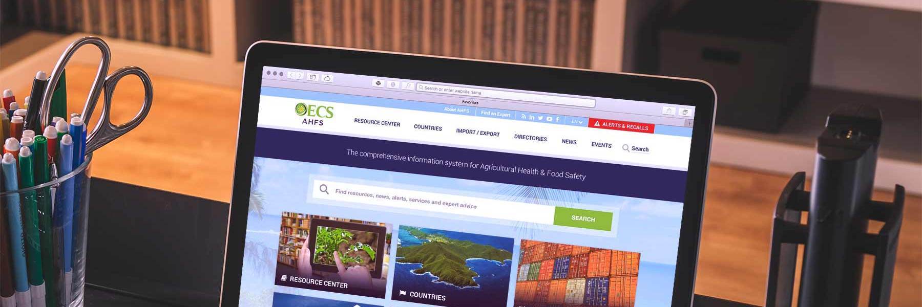 OECS website prototype shown on a laptop